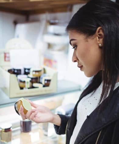 Woman checking labels of the product