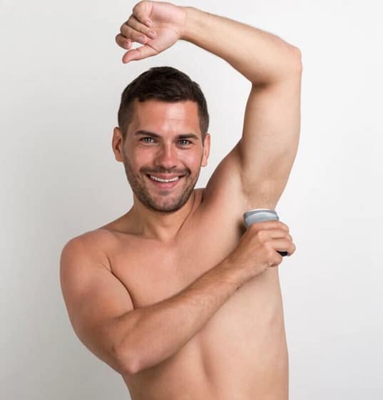 21D529D1-BEC1-4E91-B5B2-32C218010BAE Man using a stick deodorant