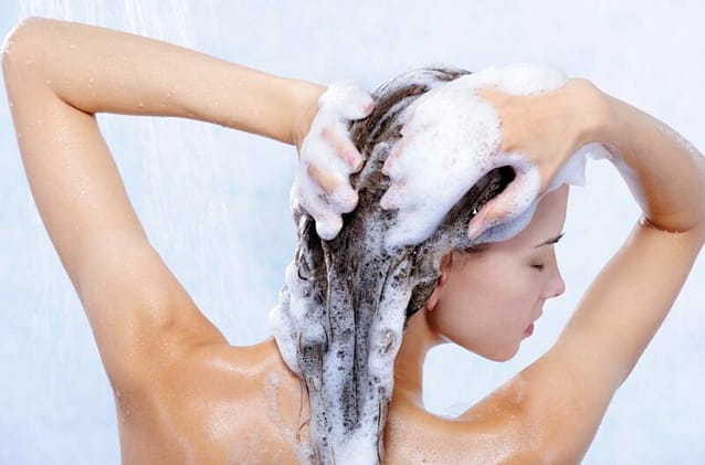 Woman shampooing her hair