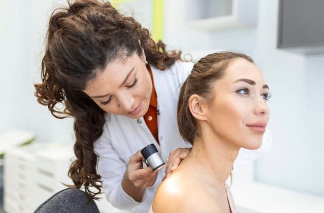 1E84D259-E2F7-4E58-B8F8-F6774307DE09 Woman visiting her dermatologist for a check up