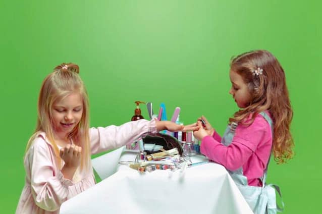 9F97F64A-F082-4042-8049-85D9663EA6FD Kids applying nail polish on their nails