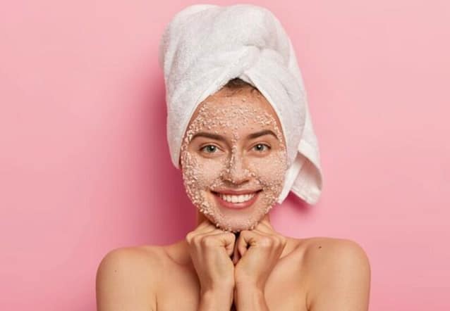 Happy woman with her natural Face scrub