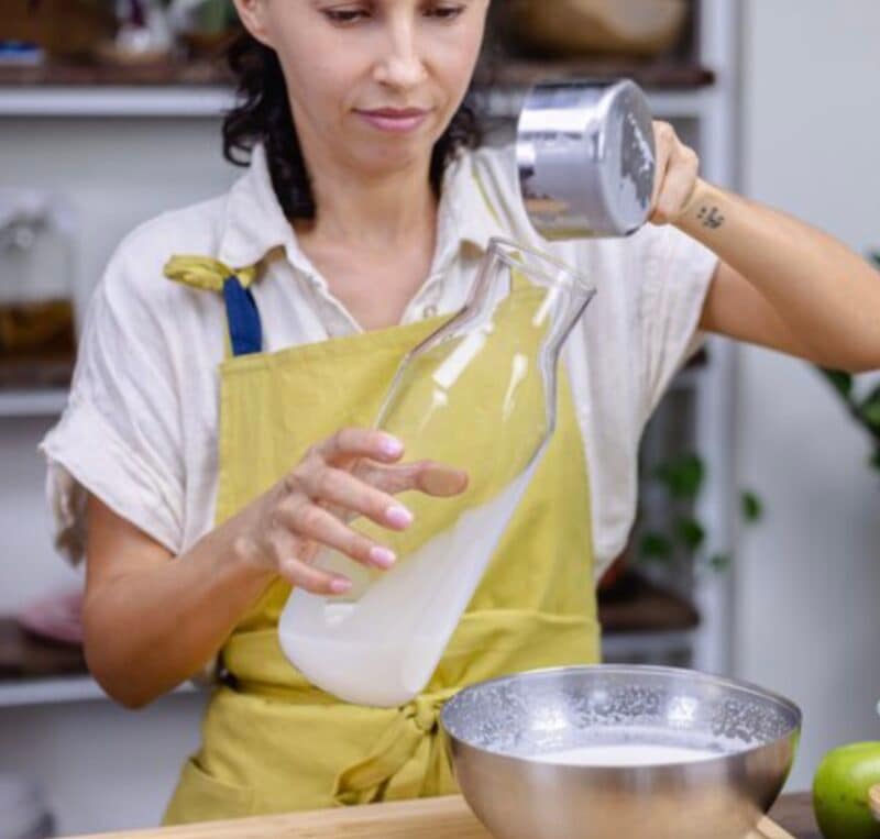 Woman Crafting Creamy Almond Milk at Home