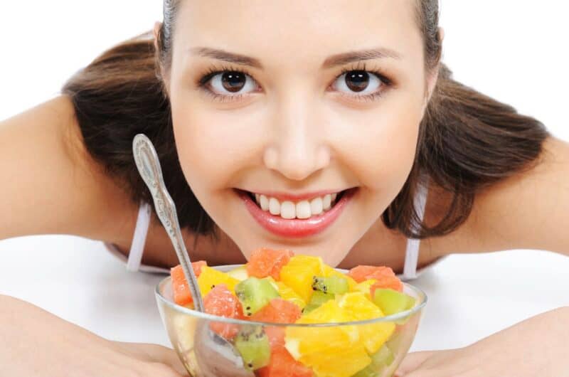 Beautiful woman with her fruit salad