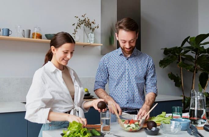 Couple preparing vegan food at home